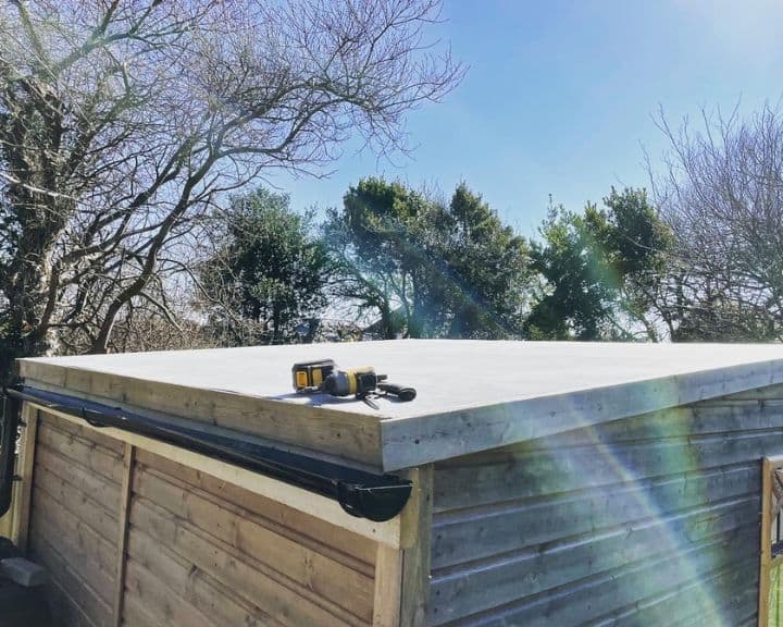 Newly constructed flat roof on wooden shed